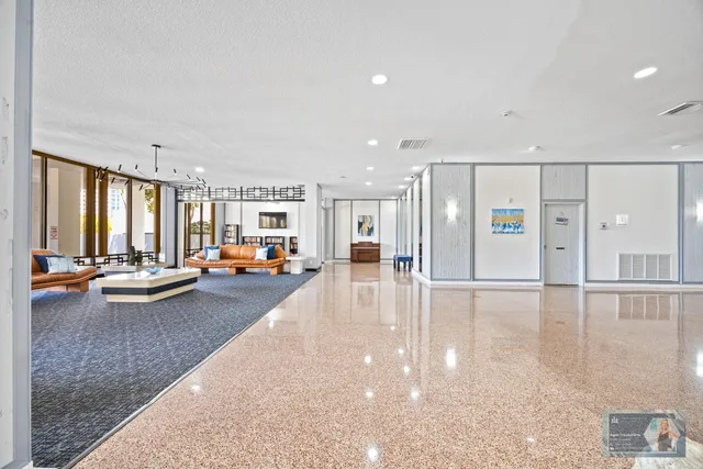 a view of a patio with a table and chairs