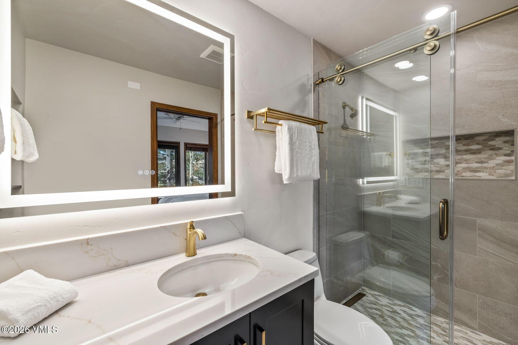167 Saddle Ridge Edwards, CO 81632 - Photo 26 of 41 a bathroom with a sink toilet and shower