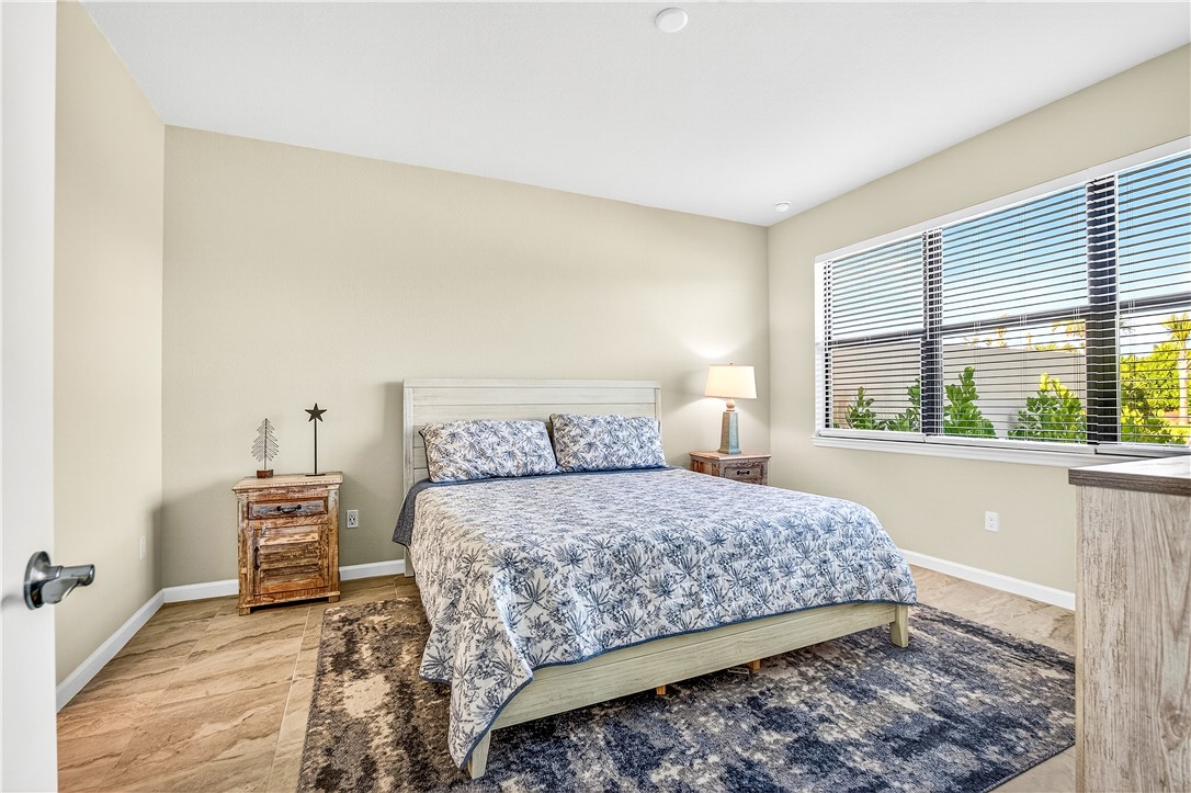 4229 Silver Maple Way Vero Beach, FL 32967 - Photo 18 of 36 a bedroom with a bed and a window