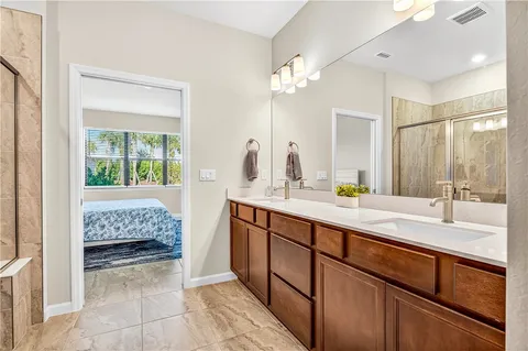 a bathroom with a tub sink and mirror