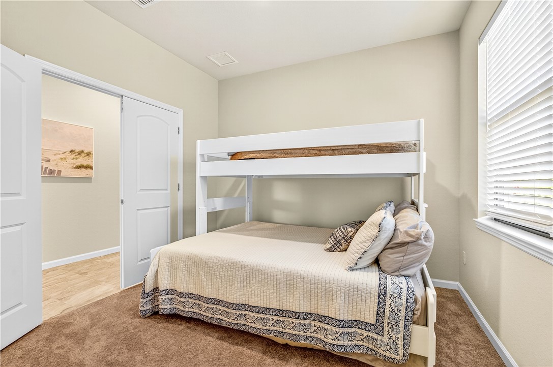 4229 Silver Maple Way Vero Beach, FL 32967 - Photo 25 of 36 a bedroom with a bed and a window