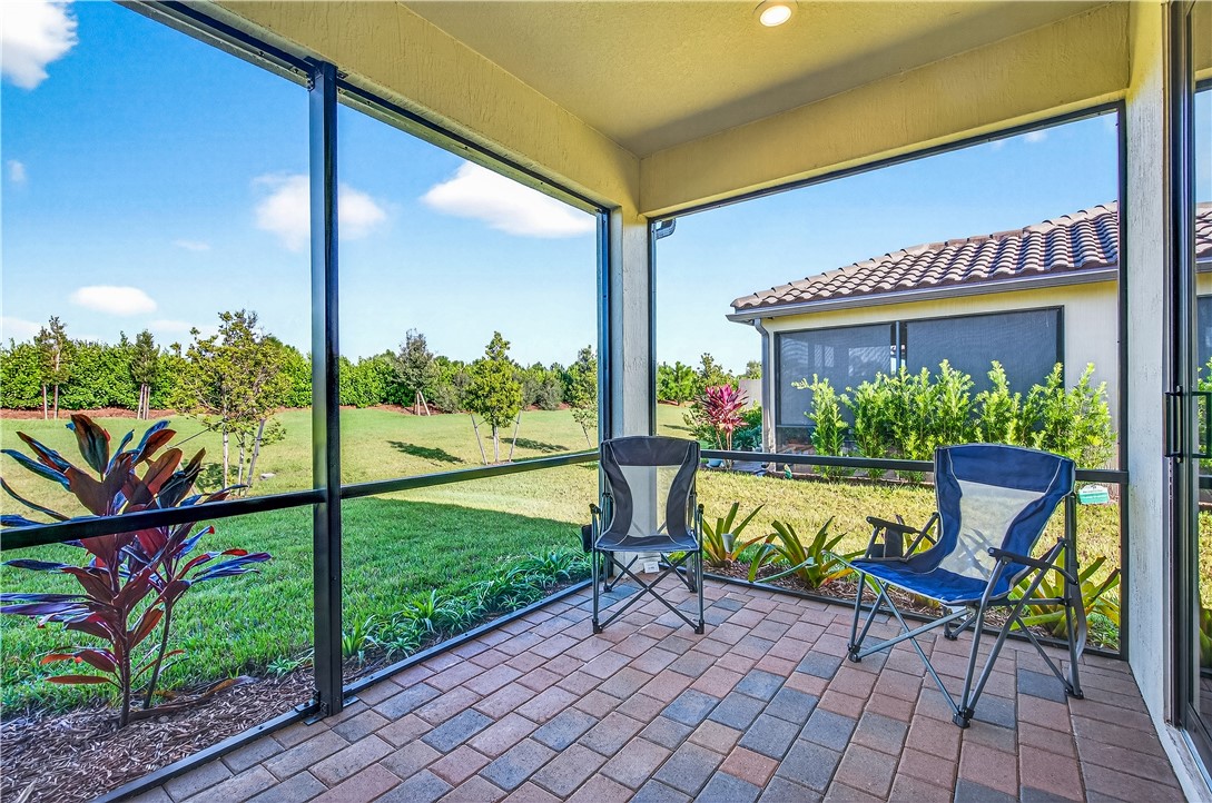 4229 Silver Maple Way Vero Beach, FL 32967 - Photo 3 of 36 a view of an chairs and table in the patio