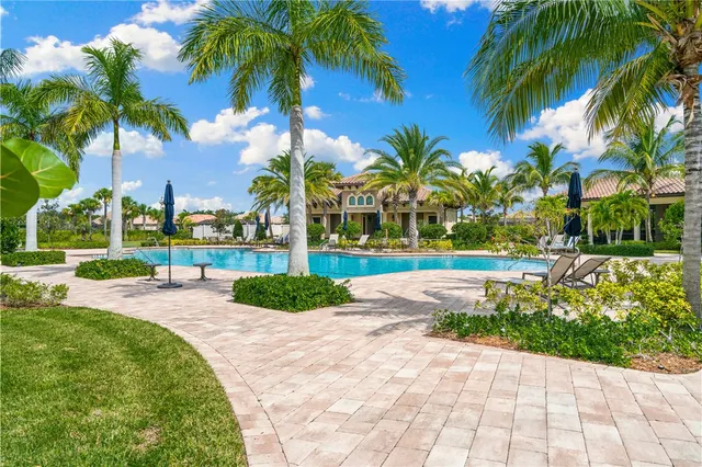 a view of a yard and palm trees