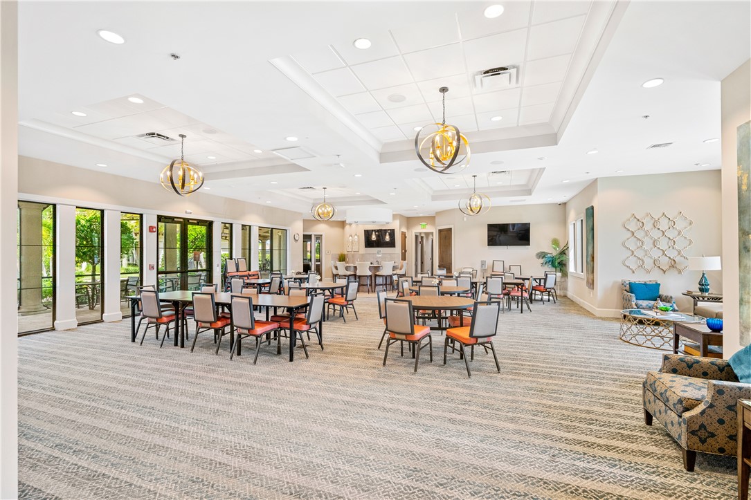 4229 Silver Maple Way Vero Beach, FL 32967 - Photo 36 of 36 a view of a dining area with furniture window and wooden floor