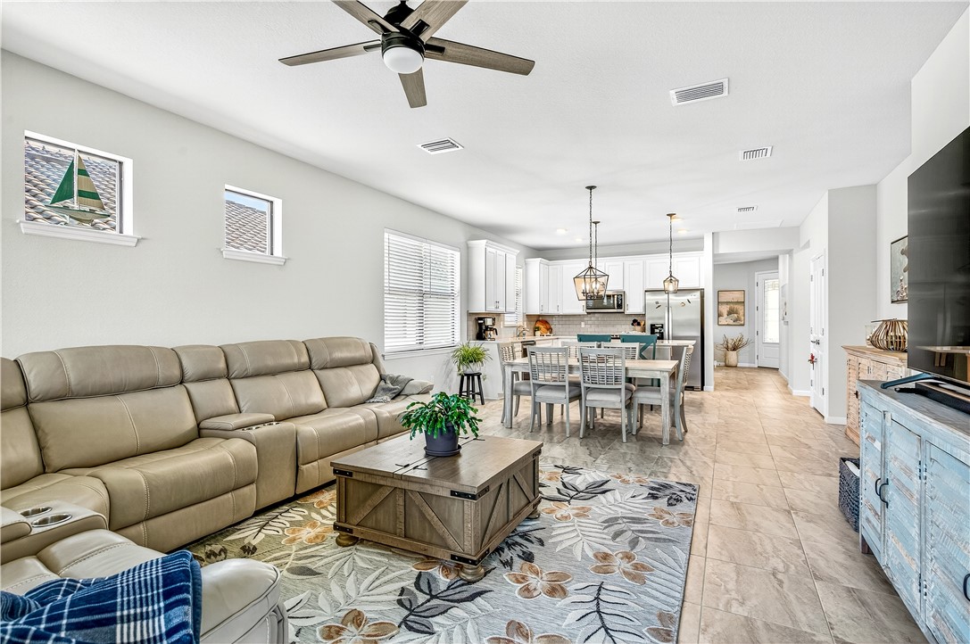 4229 Silver Maple Way Vero Beach, FL 32967 - Photo 5 of 36 a living room with furniture kitchen view and a window