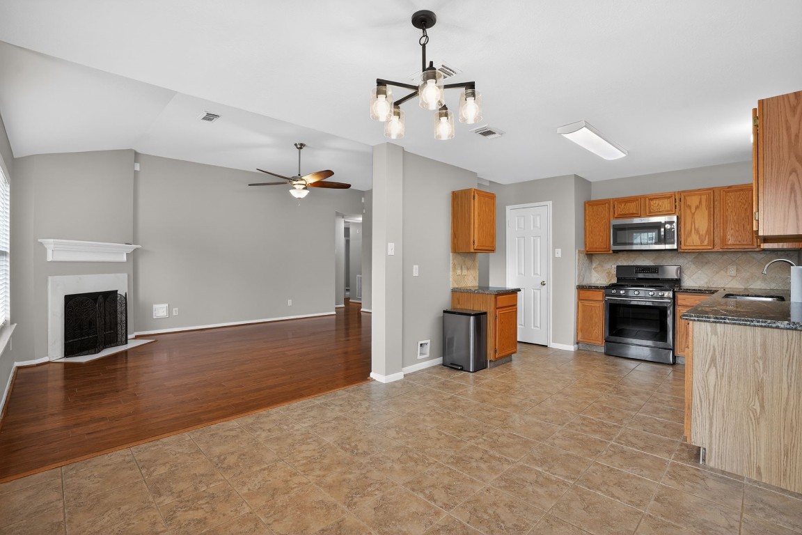 18622 Timbers Drive Humble, TX 77346 - Photo 11 of 34 a view of kitchen with sink microwave and refrigerator