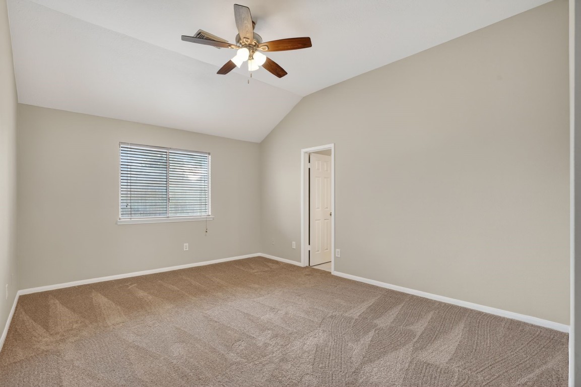 18622 Timbers Drive Humble, TX 77346 - Photo 17 of 34 an empty room with a window and a fan