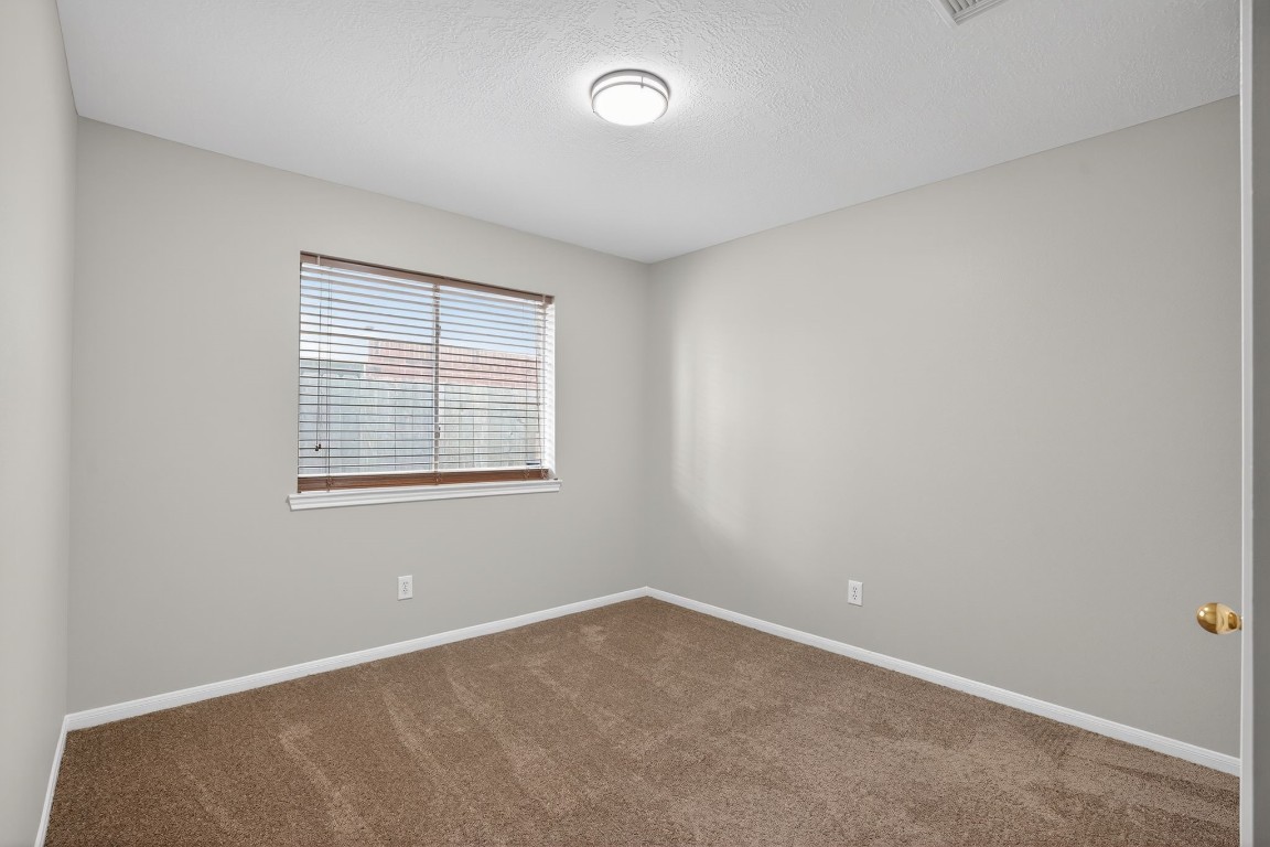 18622 Timbers Drive Humble, TX 77346 - Photo 22 of 34 an empty room with a window
