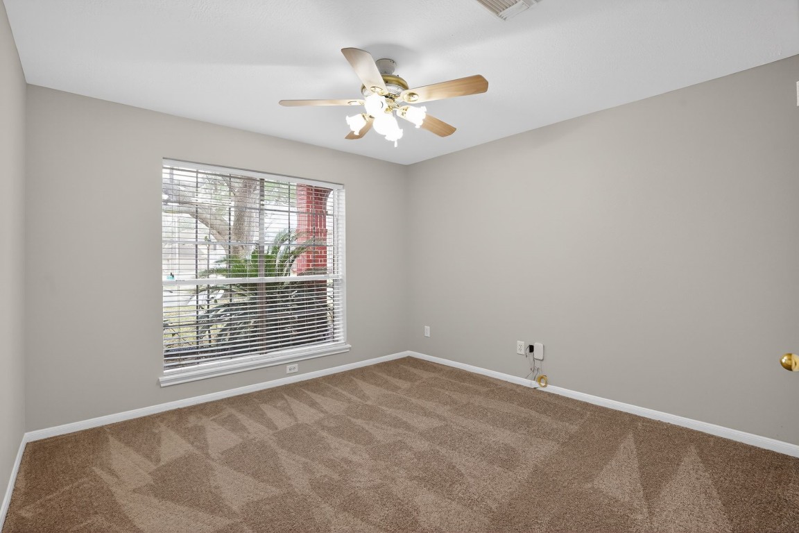 18622 Timbers Drive Humble, TX 77346 - Photo 24 of 34 a view of an empty room with a window