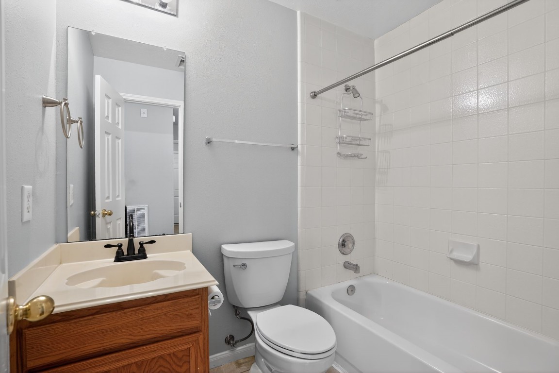 18622 Timbers Drive Humble, TX 77346 - Photo 27 of 34 a bathroom with a sink toilet and shower
