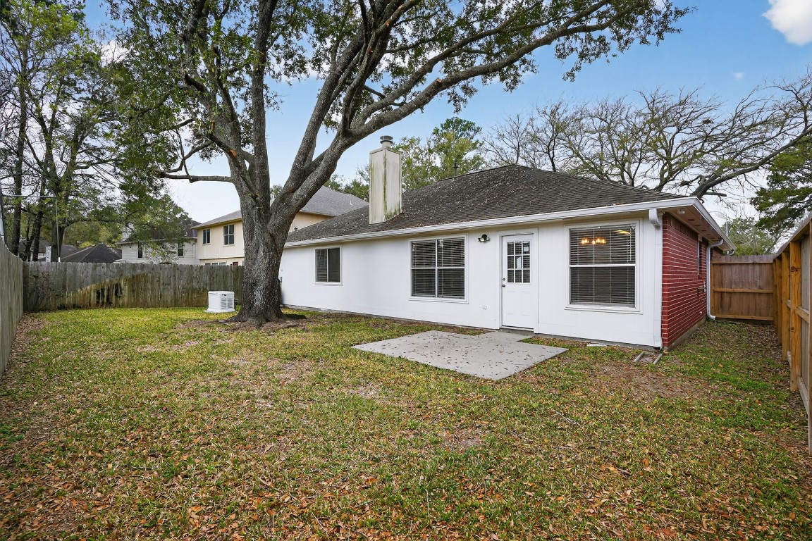 18622 Timbers Drive Humble, TX 77346 - Photo 33 of 34 a view of a house with a yard