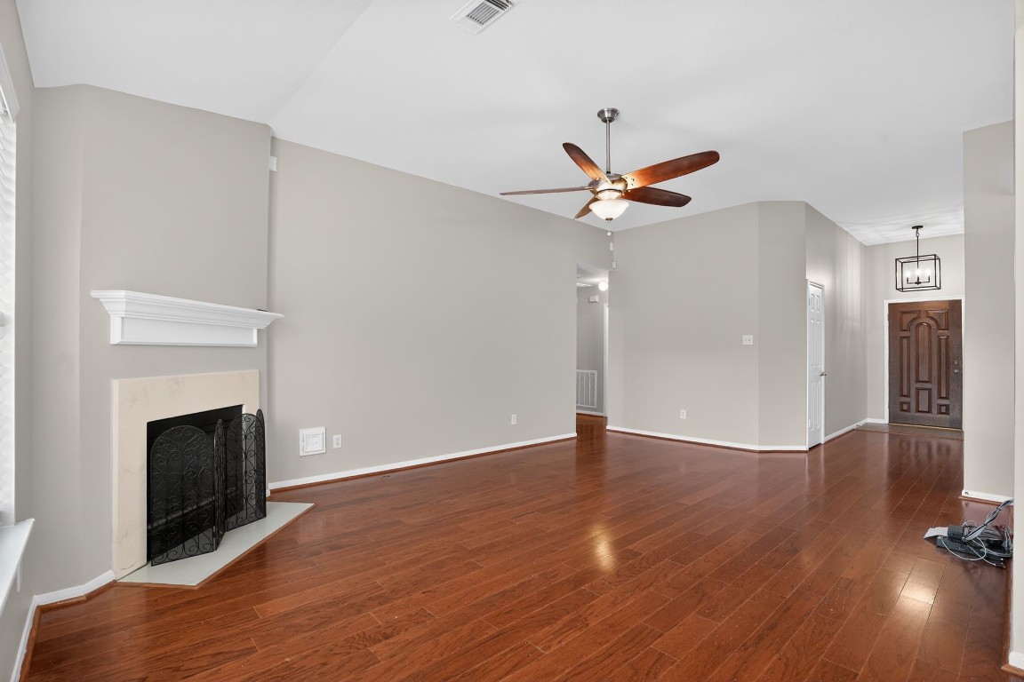 18622 Timbers Drive Humble, TX 77346 - Photo 7 of 34 a view of an empty room with wooden floor