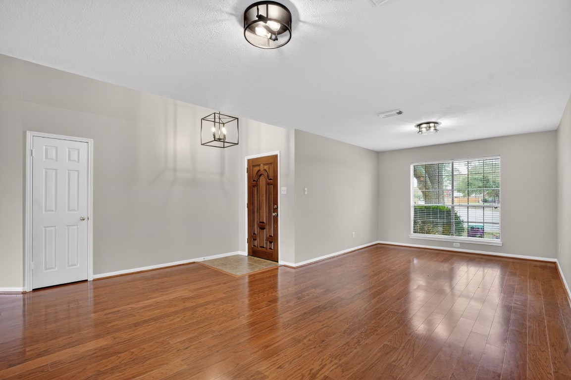 18622 Timbers Drive Humble, TX 77346 - Photo 9 of 34 a view of a livingroom with wooden floor