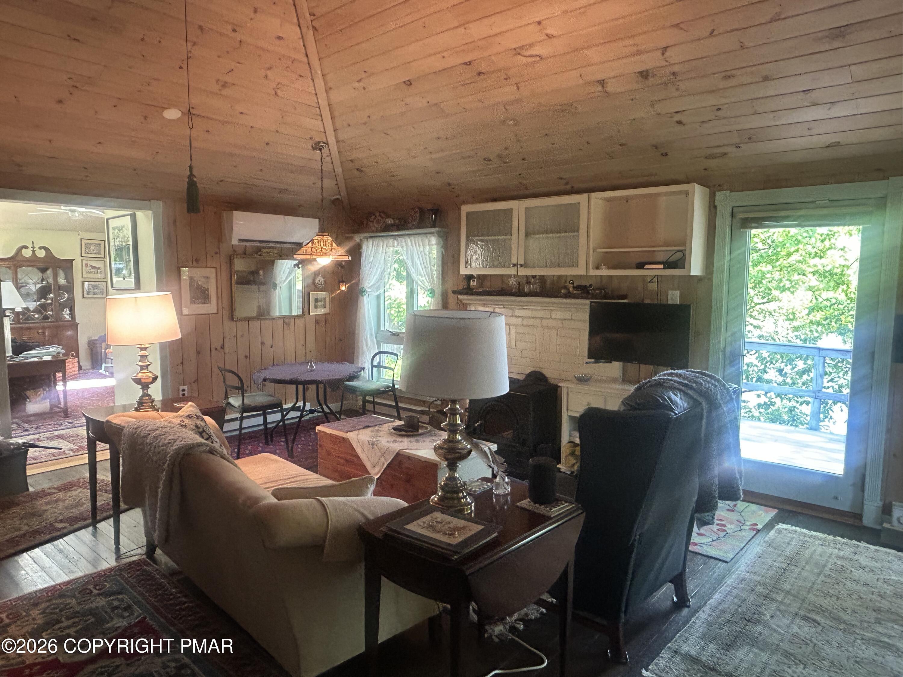 4379 River Road Mount Bethel, PA 18343 - Photo 36 of 48 a living room with furniture a window and a table