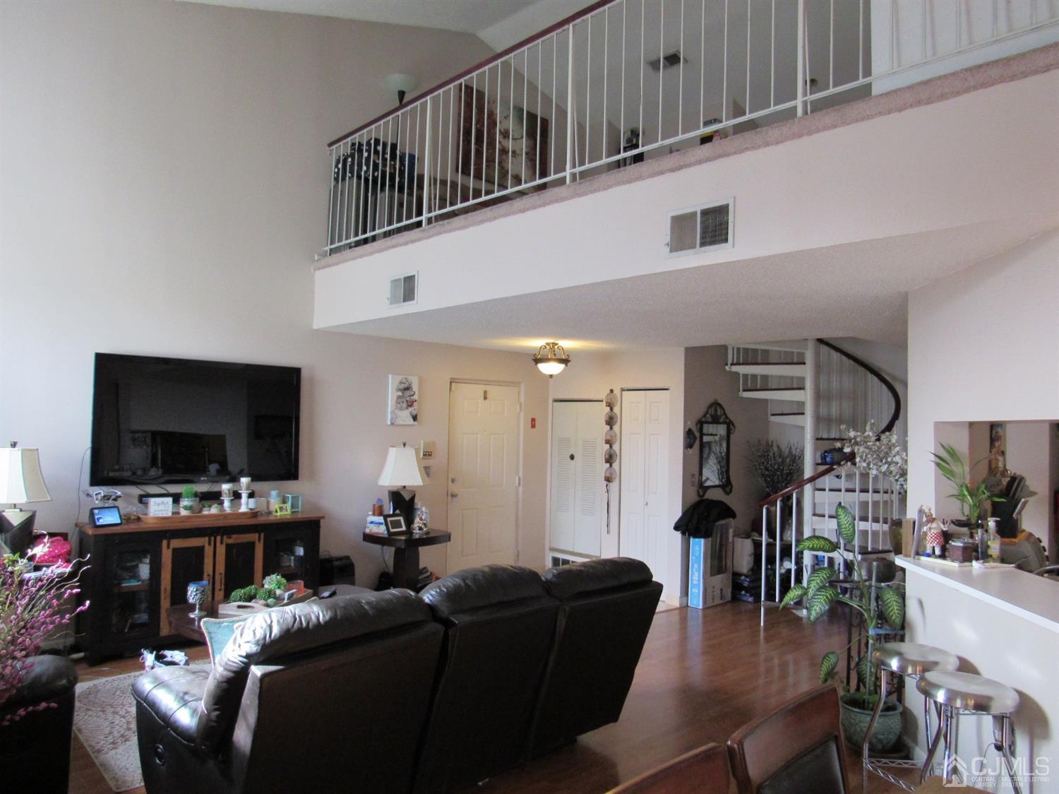333 Edpas Road New Brunswick, NJ 08901 - Photo 11 of 24 a living room with furniture and a flat screen tv