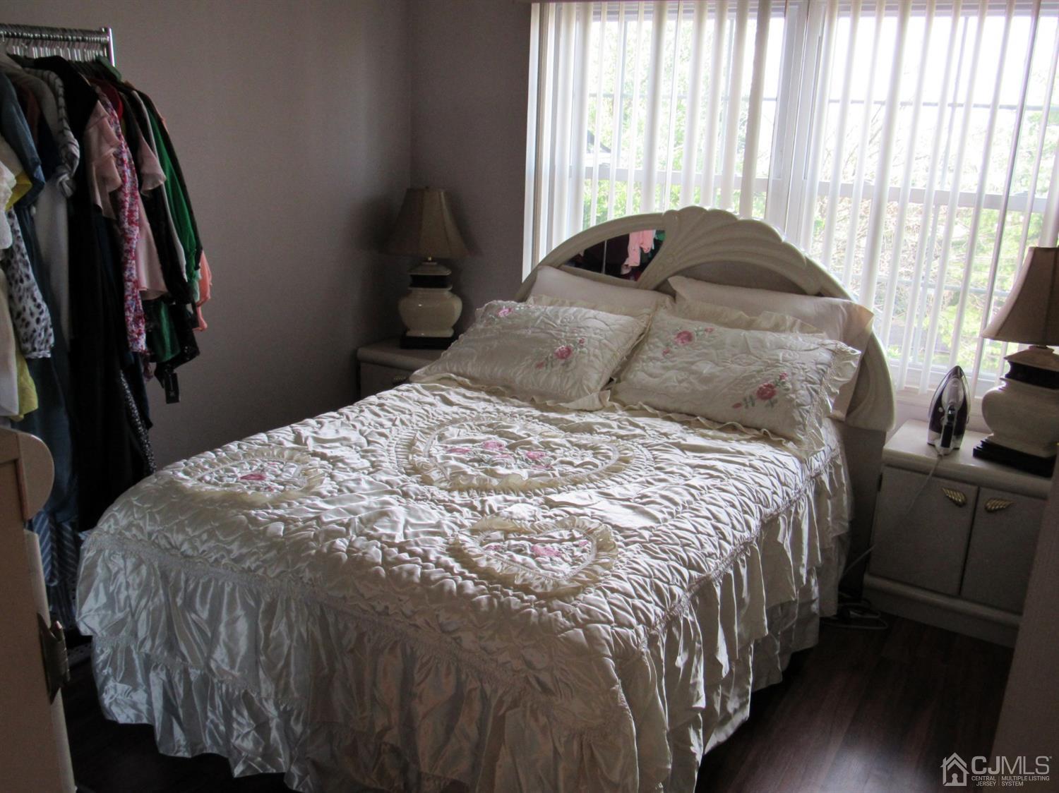 333 Edpas Road New Brunswick, NJ 08901 - Photo 22 of 24 a large bed sitting in a bedroom next to a window