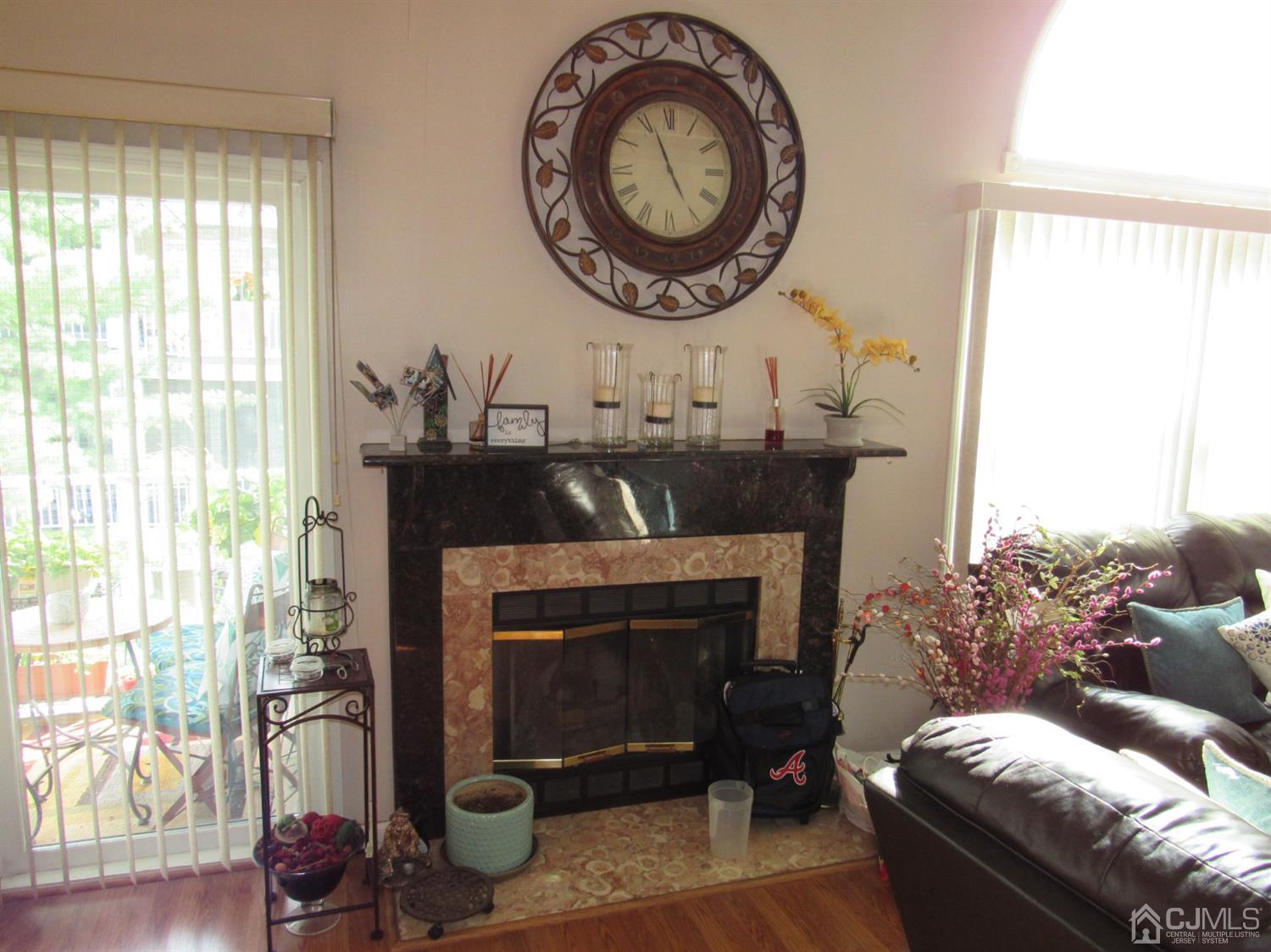 333 Edpas Road New Brunswick, NJ 08901 - Photo 7 of 24 a living room with furniture a window and a fireplace
