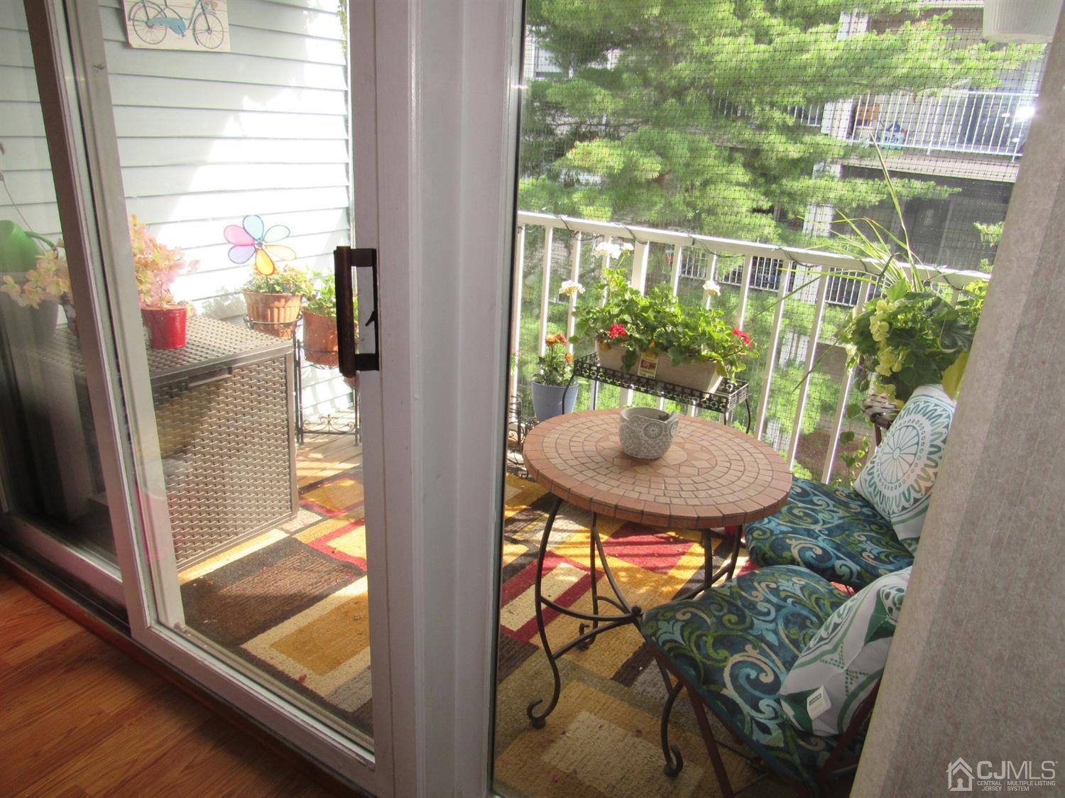 333 Edpas Road New Brunswick, NJ 08901 - Photo 8 of 24 a view of a balcony with table and chairs