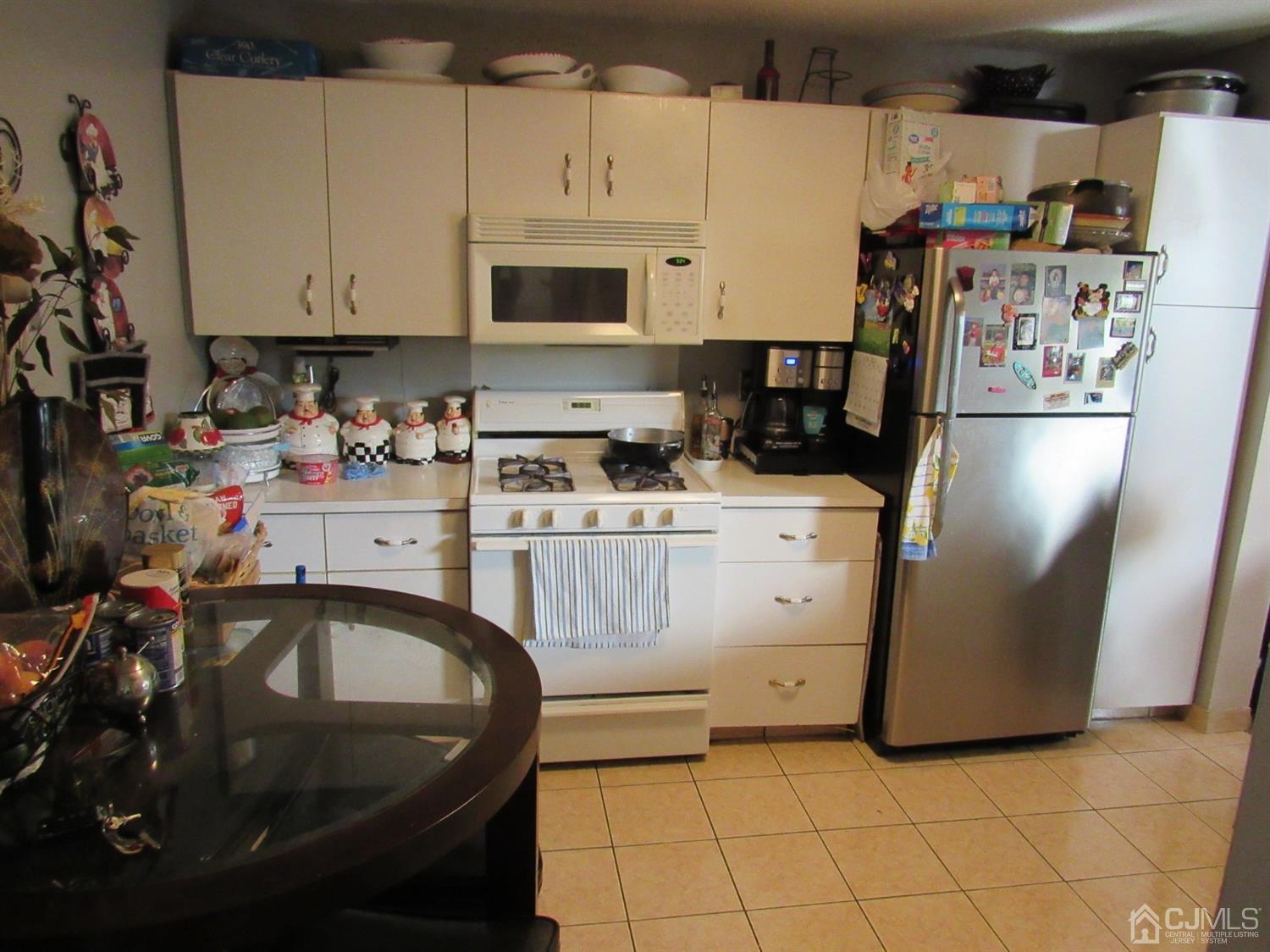 333 Edpas Road New Brunswick, NJ 08901 - Photo 9 of 24 a kitchen with a sink a stove and cabinets