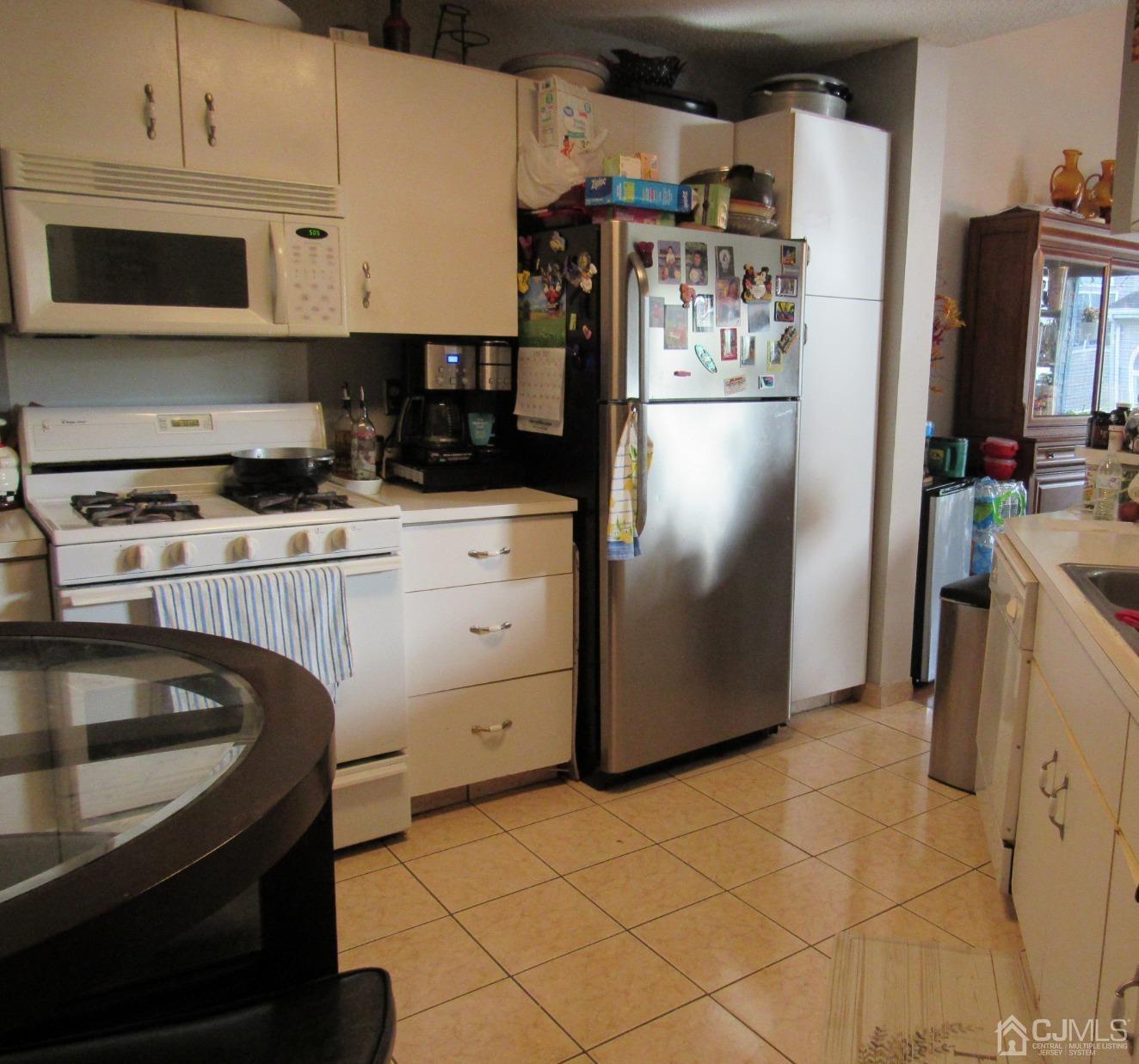 333 Edpas Road New Brunswick, NJ 08901 - Photo 10 of 24 a kitchen with stainless steel appliances granite countertop a refrigerator a stove and a sink