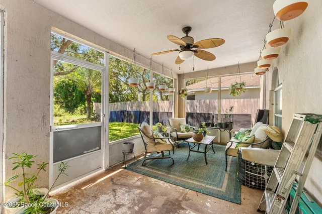 a dining room with furniture and a window