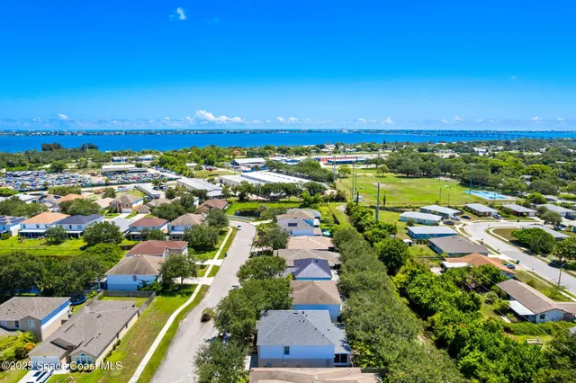 an aerial view of residential houses with outdoor space