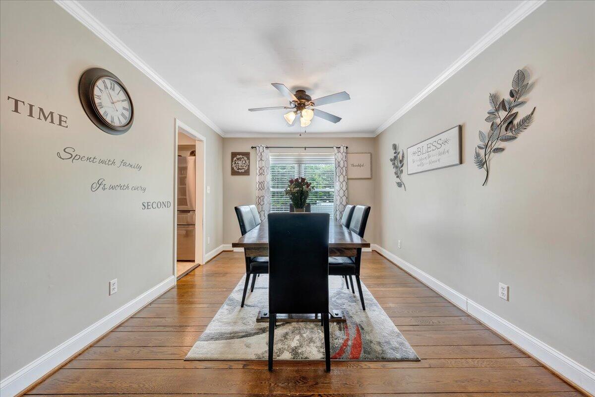 541 Stonehaven Lane Blue Ridge, VA 24064 - Photo 7 of 54 a dining room with furniture a potted plant and wooden floor