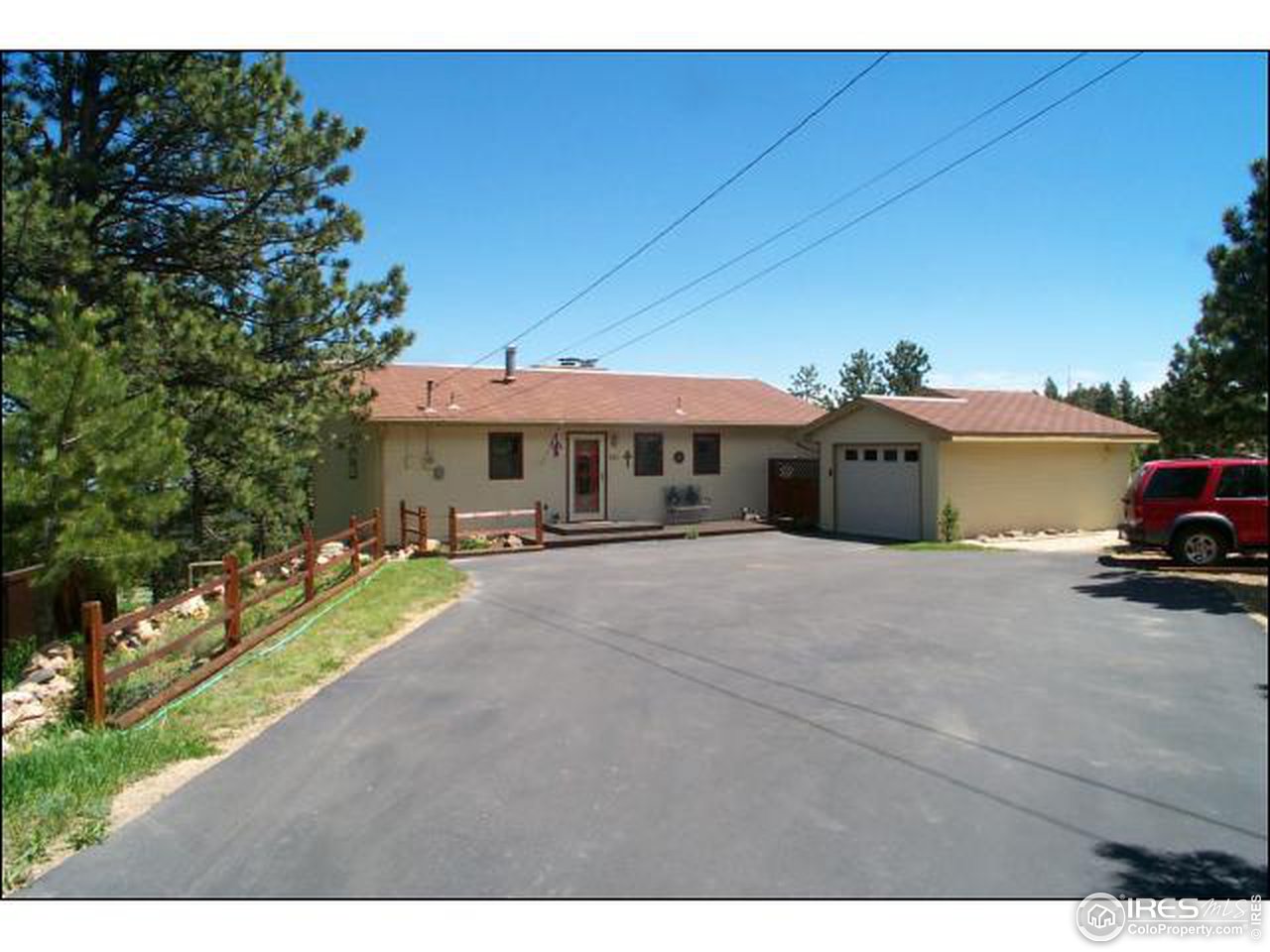 303 Deer Trail Road Boulder, CO 80302 - Photo 1 of 9 a front view of a house with a yard