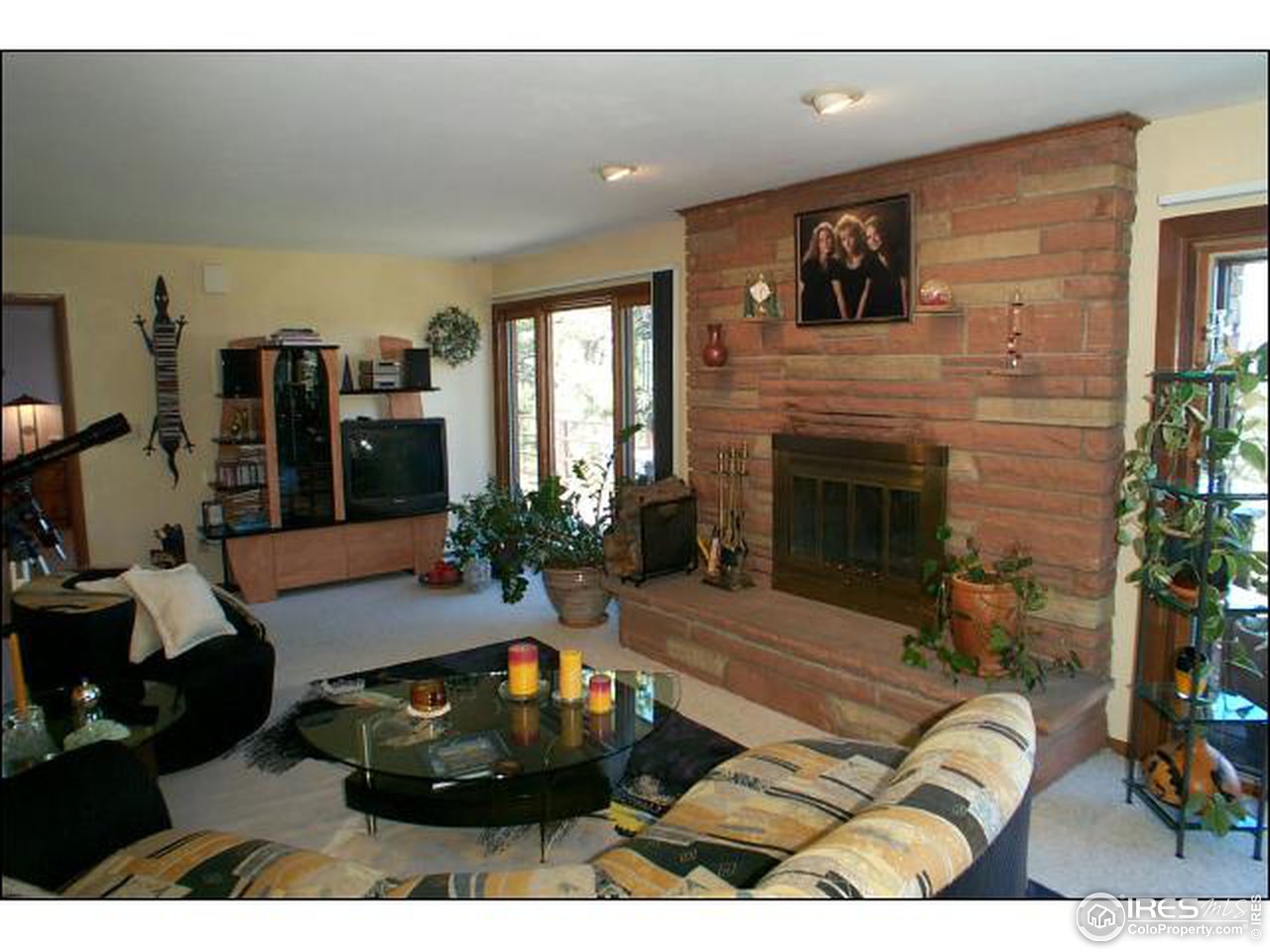 303 Deer Trail Road Boulder, CO 80302 - Photo 5 of 9 a living room with furniture and a fireplace