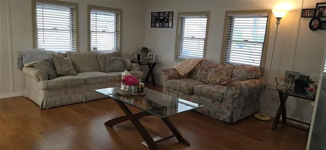 a bedroom with a bed and a mirror