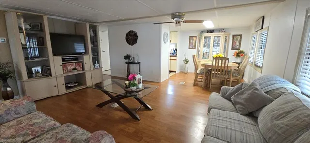 a bathroom with a toilet a sink a mirror a bathtub and vanity