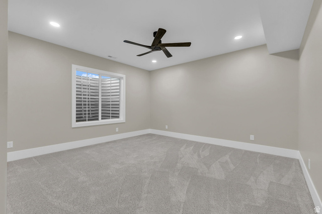 2828 Jojo Road Eagle Mountain, UT 84005 - Photo 47 of 63 Carpeted room featuring a ceiling fan, recessed lighting, and a white-framed window with a window well
