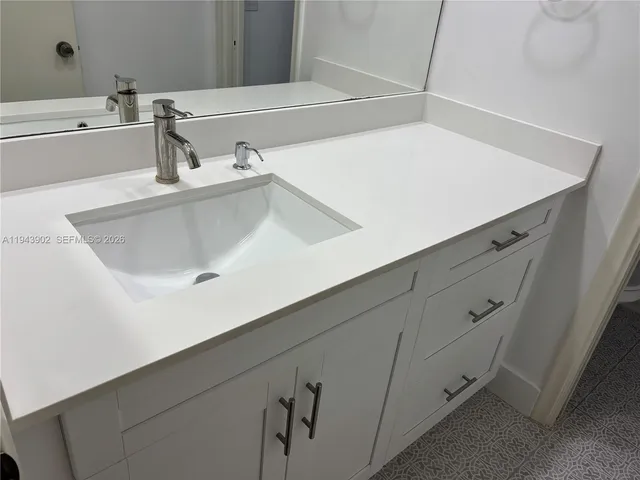 a bathroom with a toilet and a bath tub