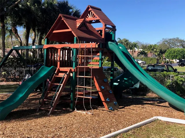 a view of a street with a car parked in front of it