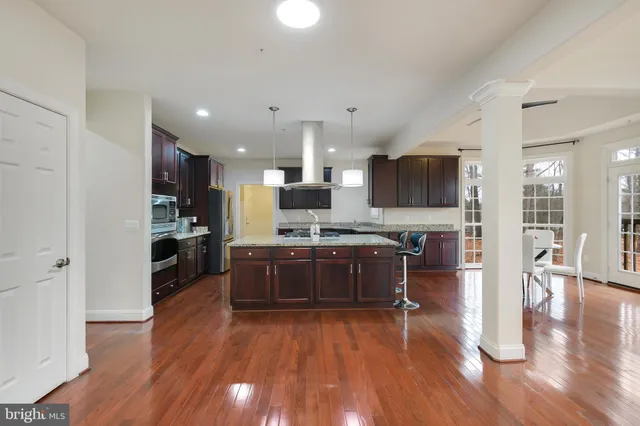 a kitchen with stove and cabinets