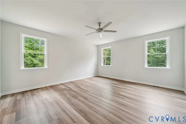 a bathroom with a double vanity sink a mirror and a shower