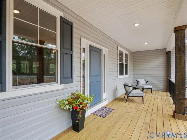 a balcony with furniture and flowers