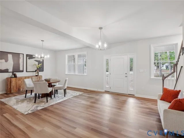 a view of a dining room with furniture window and wooden floor