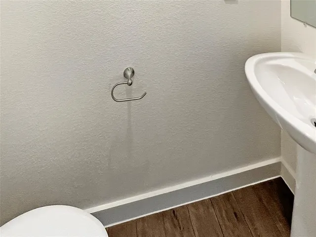 a bathroom with a toilet and sink