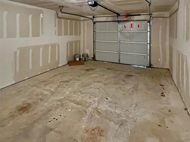 a front view of a house with garage