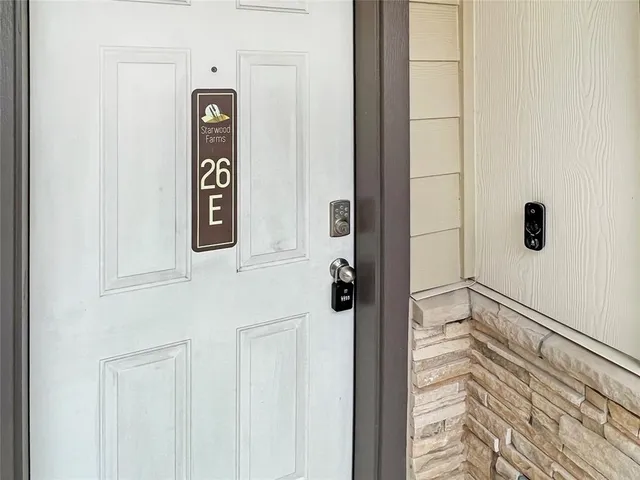 a bathroom with a shower and a sink