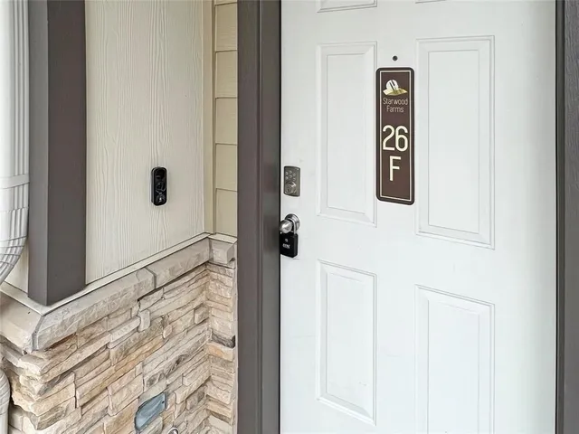 a bathroom with a shower and a sink