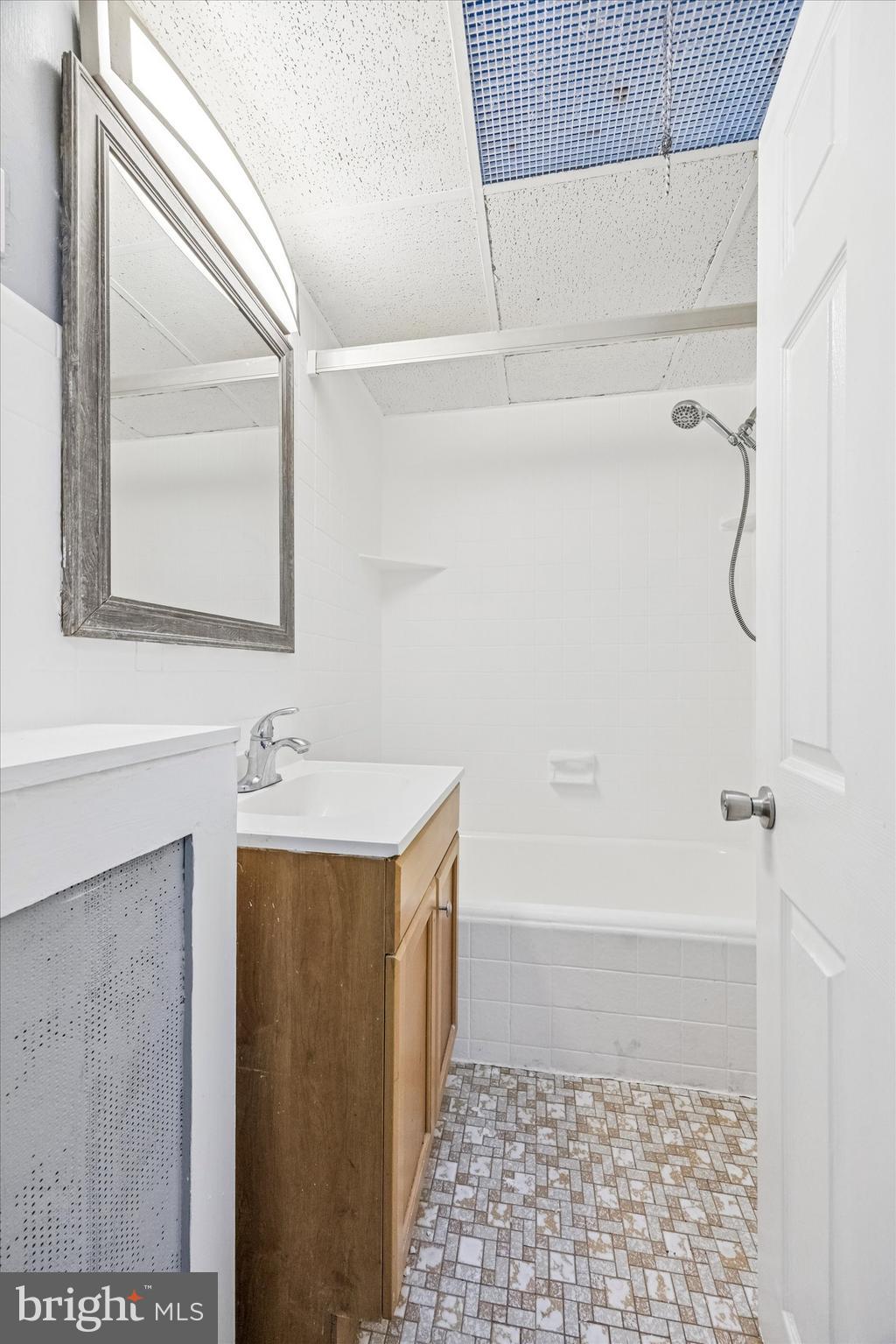 433 Copley Road Upper Darby, PA 19082 - Photo 13 of 35 a bathroom with a sink a toilet and shower