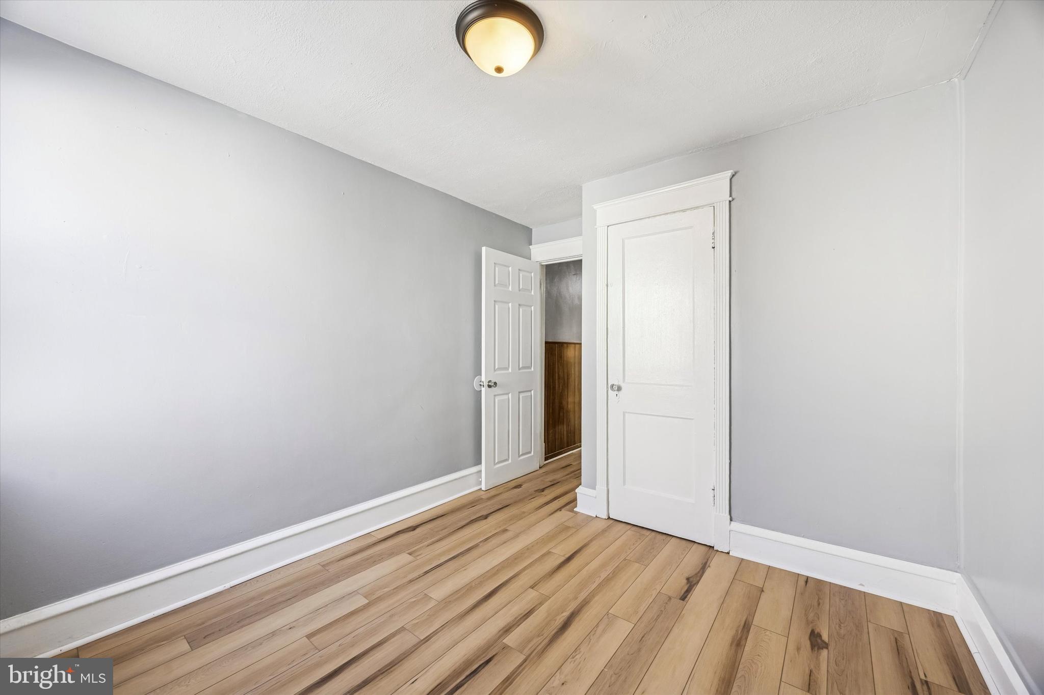 433 Copley Road Upper Darby, PA 19082 - Photo 17 of 35 a view of a room with wooden floor and white walls