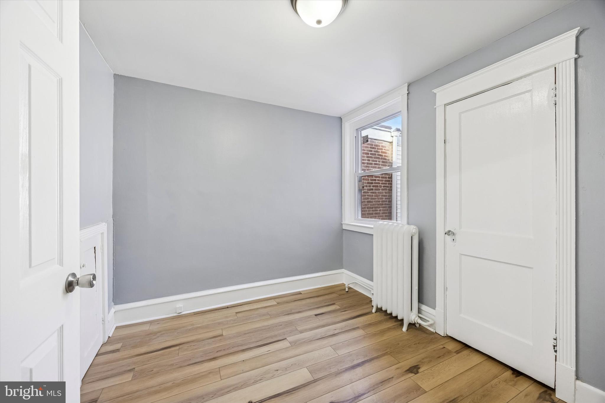 433 Copley Road Upper Darby, PA 19082 - Photo 18 of 35 a view of empty room with wooden floor and fan
