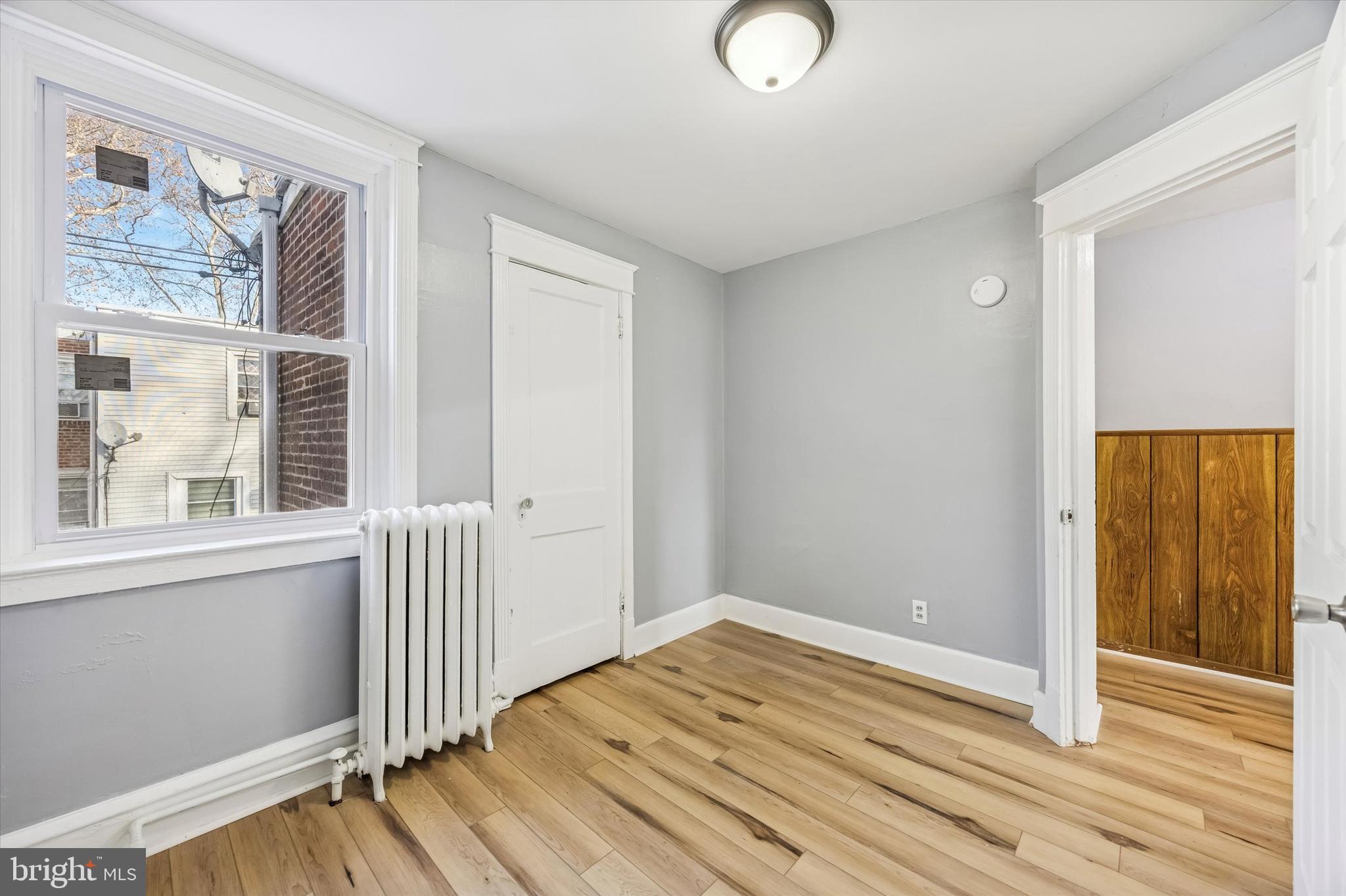 433 Copley Road Upper Darby, PA 19082 - Photo 19 of 35 a view of a room with wooden floor and windows