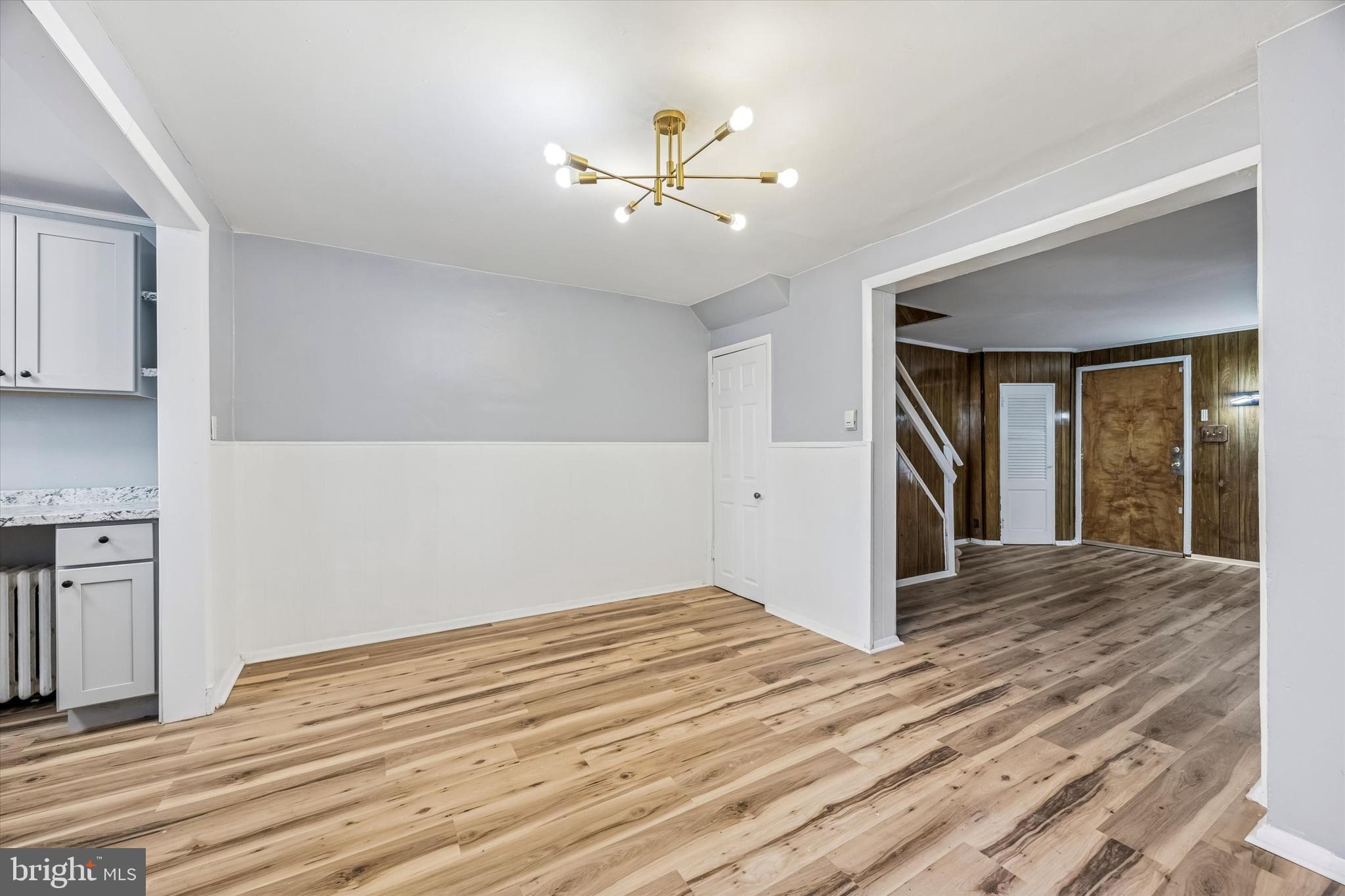 433 Copley Road Upper Darby, PA 19082 - Photo 2 of 35 a view of an empty room with wooden floor and a ceiling fan
