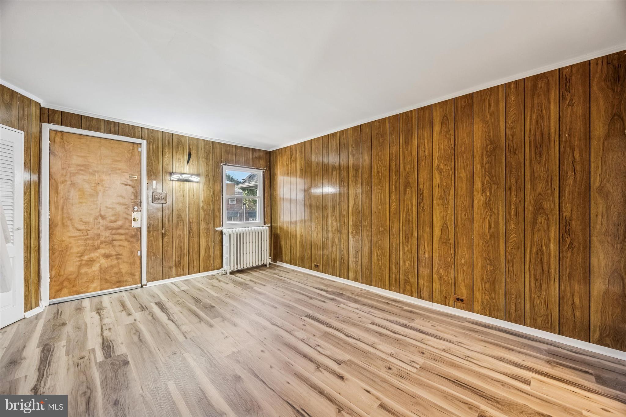 433 Copley Road Upper Darby, PA 19082 - Photo 7 of 35 a view of a big room with wooden floor and windows