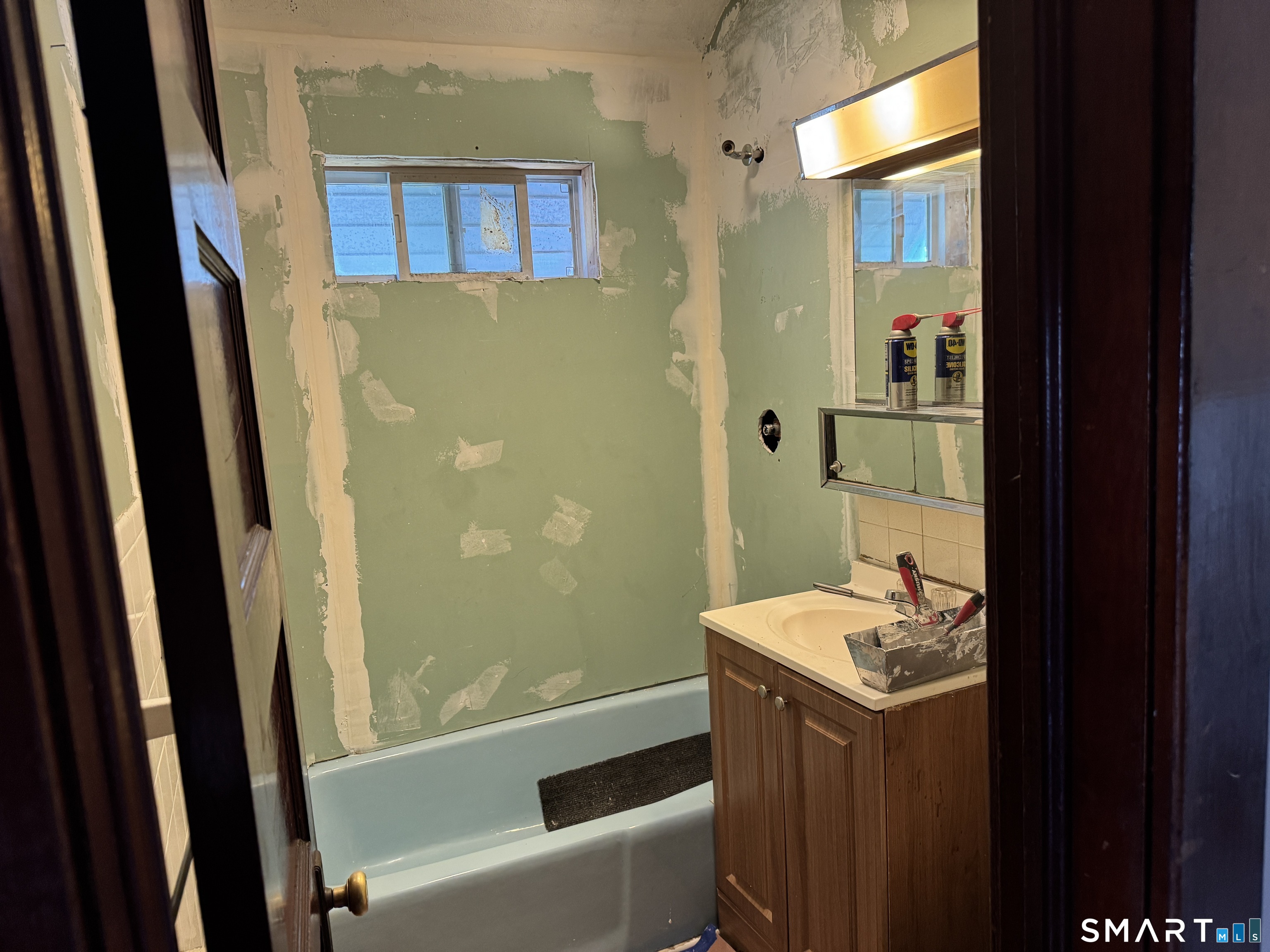 138 Greene Street Bristol, CT 06010 - Photo 19 of 32 a bathroom with a sink a bathtub and a shower