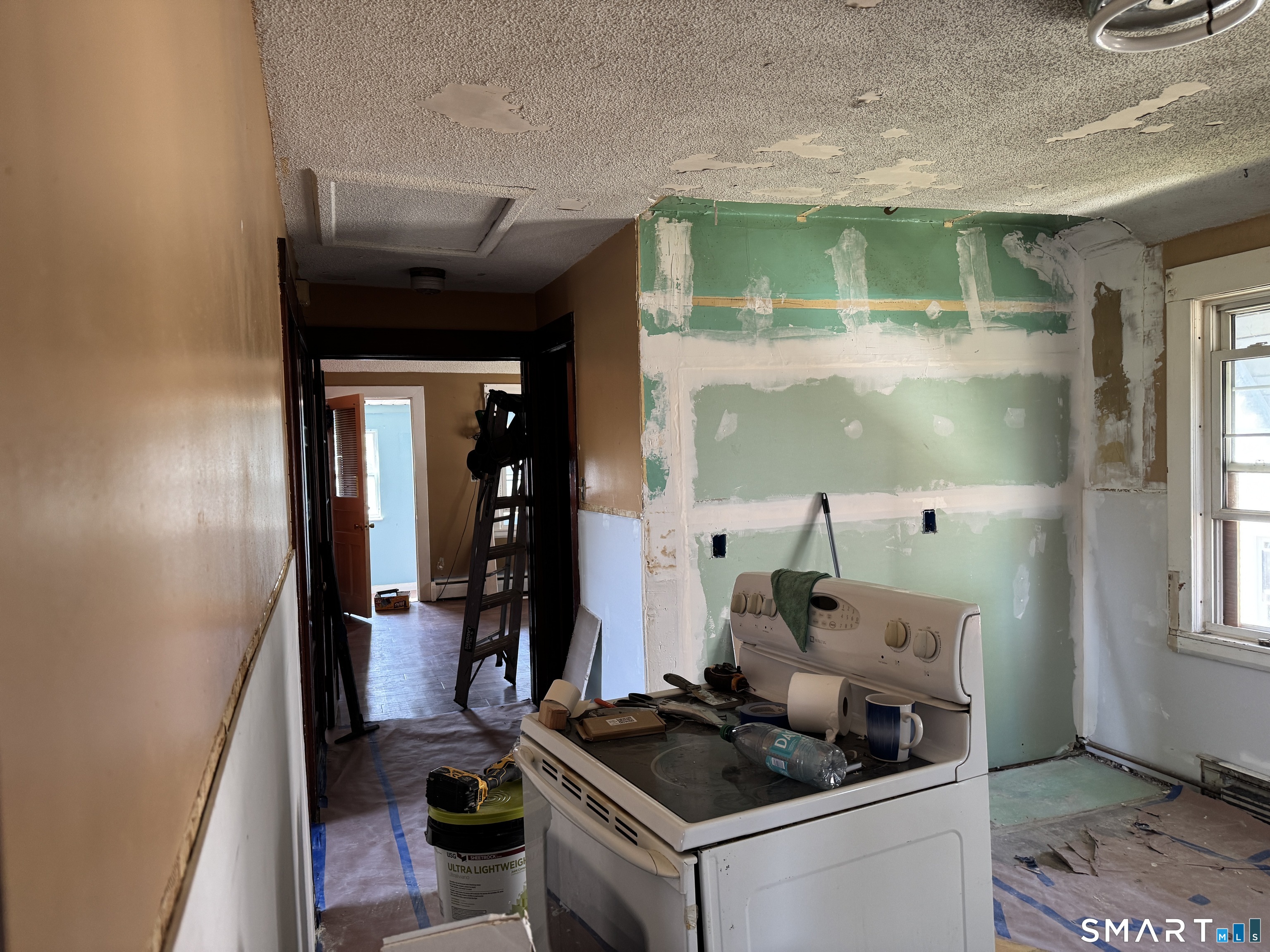 138 Greene Street Bristol, CT 06010 - Photo 21 of 32 a kitchen with a stove and a wooden floors